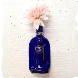 Neal's Yard recycled glass bottle vase